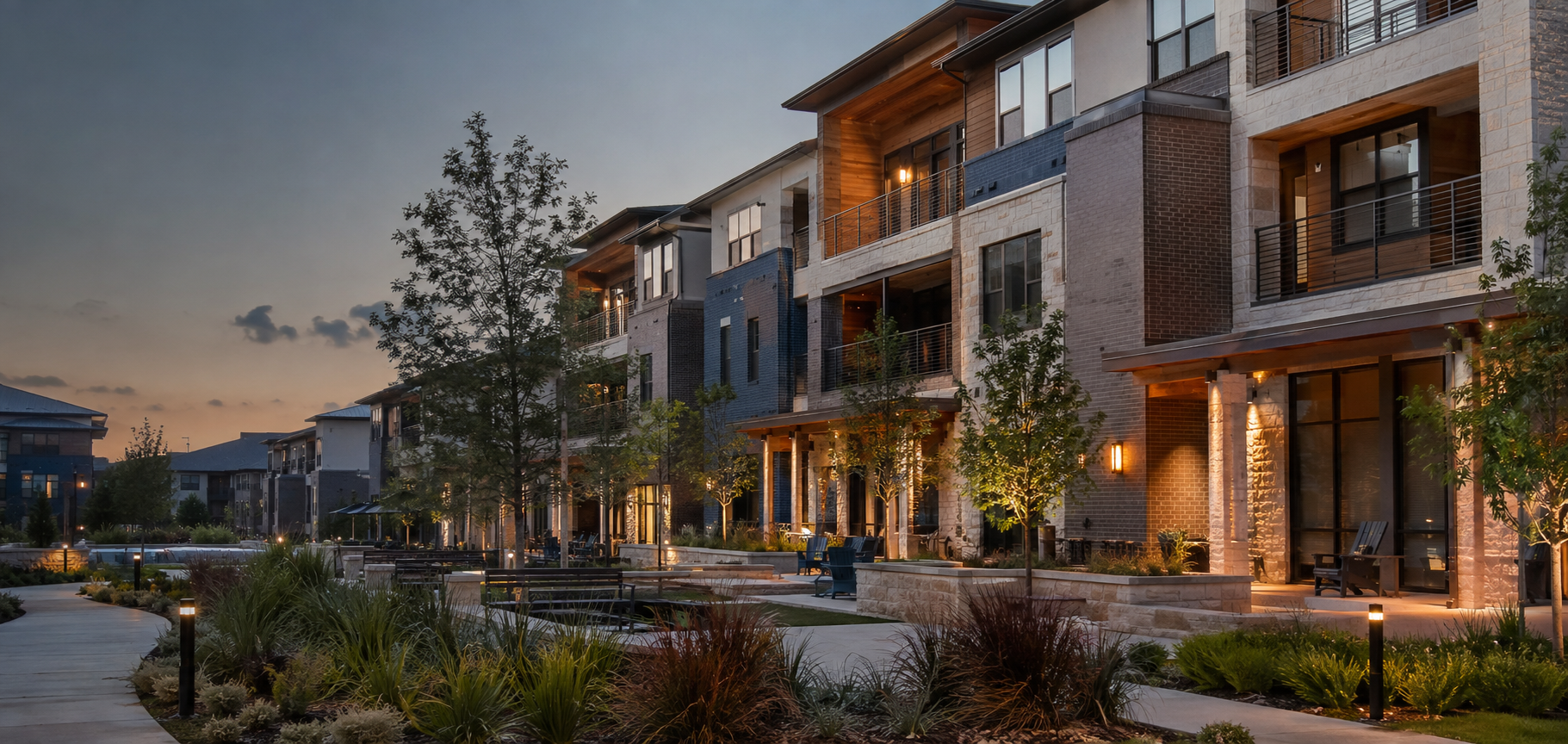 Modern multifamily apartment community at dusk
